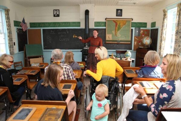 Interior of school with teacher & people